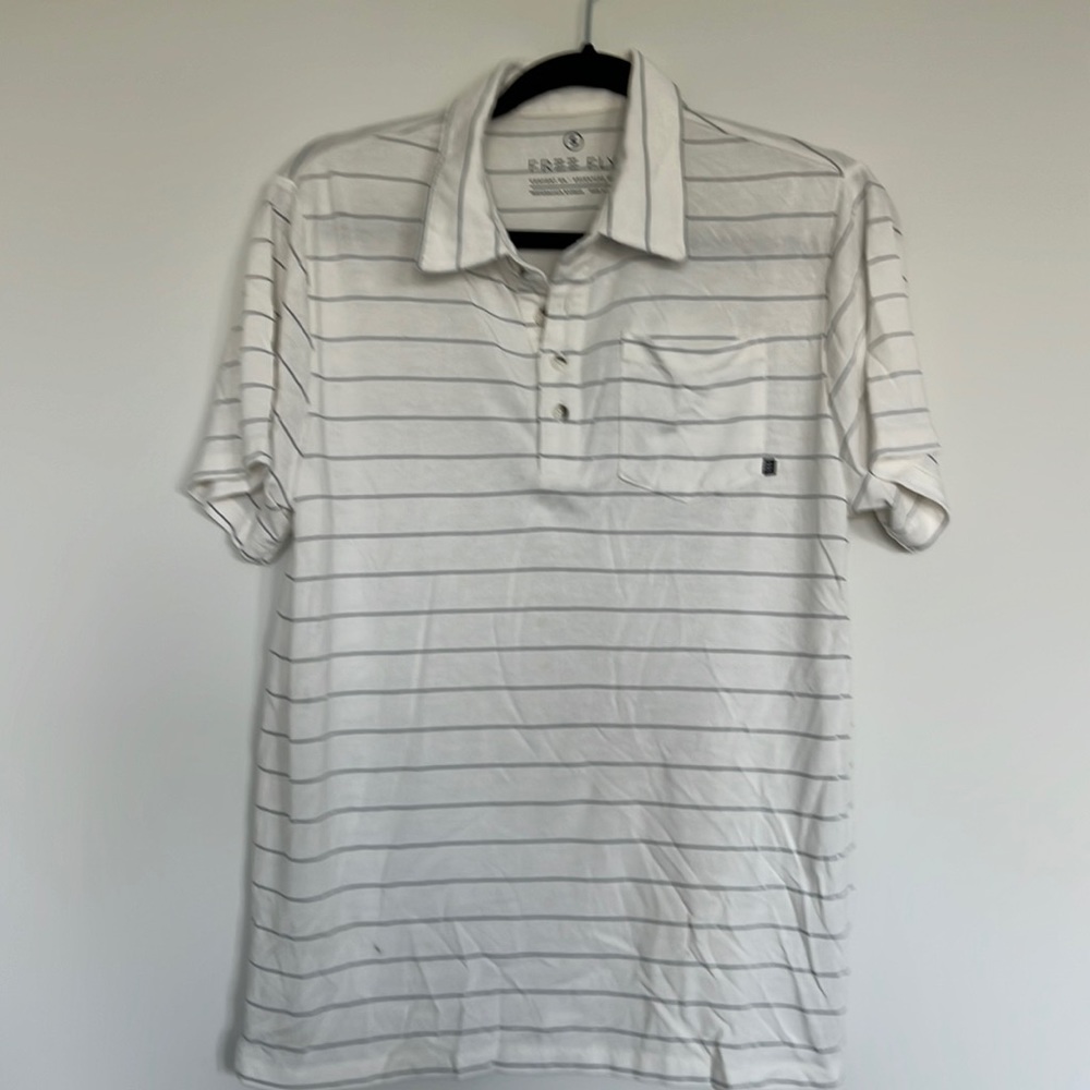 Men’s small free fly polo. Off white and gray stripe. Size small.